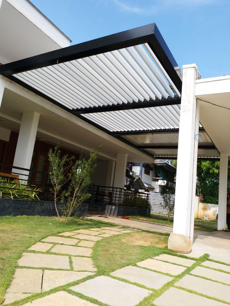 Adjustable louvered roof over a residential patio
