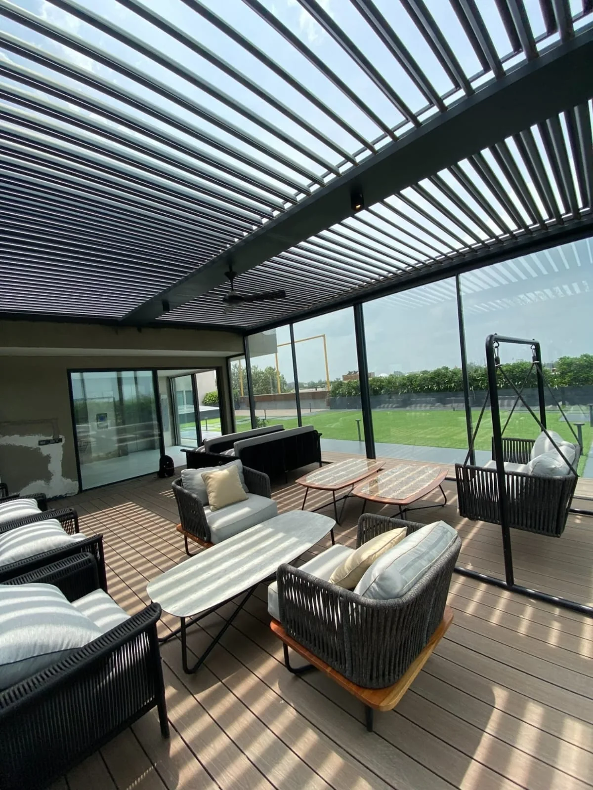 Prato louvered pergola above a furnished terrace